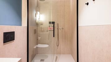 Large Room with Living Area | Bathroom | Shower, designer toiletries, hair dryer, towels