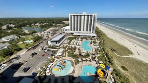 A resort with multiple swimming pools, a large hotel building, and a beach. - 1703 Brighton, newly remodeled condo with full access! (Myrtle Beach)