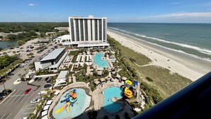 A resort with a large building, a beach, and a water park. - 1703 Brighton, newly remodeled condo with full access! (Myrtle Beach)