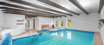 Large pool house with activity room located in peaceful surroundings.