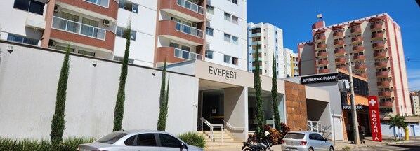A multi-story building with a prominent 'EVEREST' sign, indicating a hotel or similar establishment.