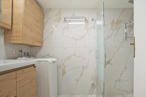 Shower, hair dryer, towels, soap