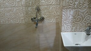 A bathroom with a sink and a faucet. - Rudraksh Home Stay (Varanasi)