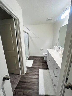Shower, hair dryer, towels, soap