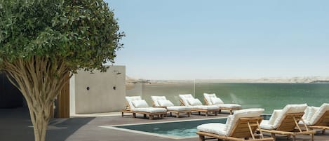 Outdoor pool, pool umbrellas, sun loungers