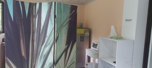 Family Apartment, Patio, Garden View | In-room dining