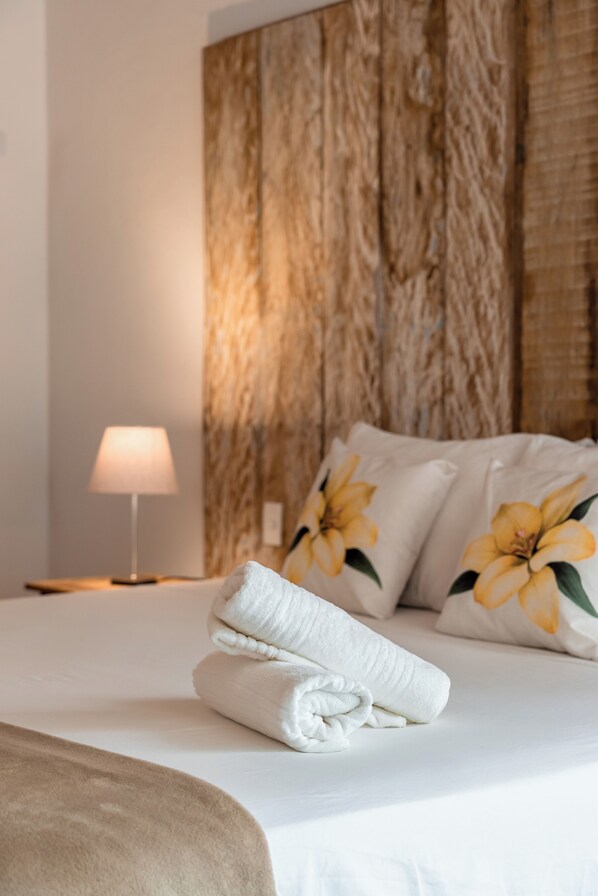 Luxury Studio Suite, 1 Bedroom, Garden View | Laptop workspace, iron/ironing board, free WiFi, bed sheets