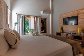 Luxury Studio Suite, 1 Bedroom, Garden View | Laptop workspace, iron/ironing board, free WiFi, bed sheets