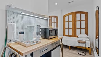 Fridge, microwave, coffee/tea maker, dining tables