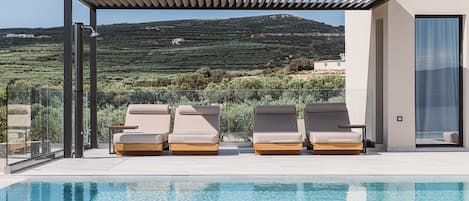 Outdoor pool, pool umbrellas, pool loungers