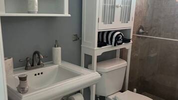 Hair dryer, towels, soap, toilet paper