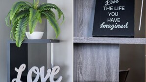 A shelf with a potted fern, a sign with the word 'Love', and another sign with motivational text. - Large 1BR Retreat, Steps from Shops & Market (Pasadena)