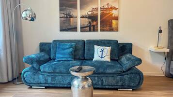 Deluxe Studio | Living area | Flat-screen TV