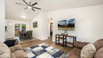 House, Multiple Beds, Balcony, Garden View (1119 S Edinburgh Drive) | Living area | 50-inch flat-screen TV with digital channels