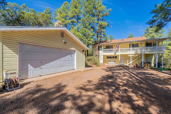 A two-story house with a garage and a balcony. - Sleeps 12-Near Lake-Family~Mountains|Cedar Escape (Show Low)