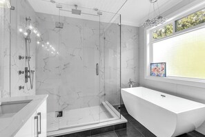 Shower, jetted bath, bidet, towels