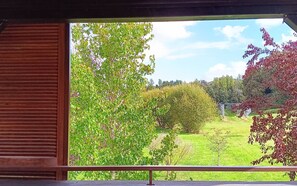 Guests can enjoy a serene view of the surrounding landscape from the comfort of their room.