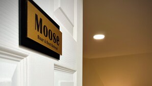 A hotel room with a sign reading "Moose Roar & Rest Retreat" on the door. - 4BR Summer Home For 10ppl with Game Room -White Mtns! (Woodstock)