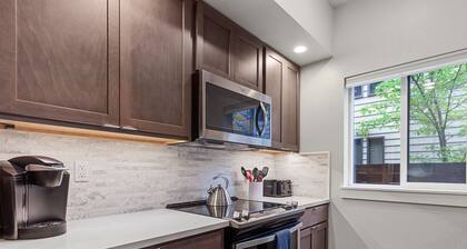 Modern Ground-Level Condo Downtown—Perfect Walkability & Shared Outdoor Space for Relaxation!