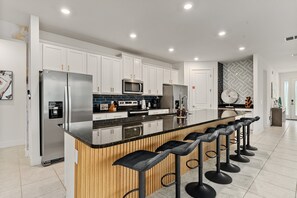 Fridge, microwave, oven, stovetop - Homestead Dream | 8 bed, 9 bath | Loft Game Area | Custom Kids Bedrooms | Reunion Membership (Kissimmee)