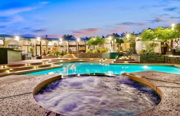 Unwind in this luxurious oasis featuring a spool and soothing hot tub.