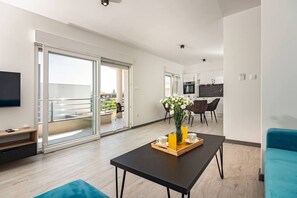 Apartment (One Bedroom Apartment) | Living room | 32-inch flat-screen TV with cable channels