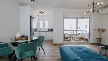 Apartment (Standard Two Bedroom Apartment (Nora)) | Living room | 32-inch flat-screen TV with cable channels