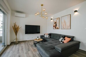 Apartment (Classic Two Bedroom Apartment (Coral)) | Living room | 32-inch flat-screen TV with cable channels - Spacious Luxury Trogir Apartments (Trogir)