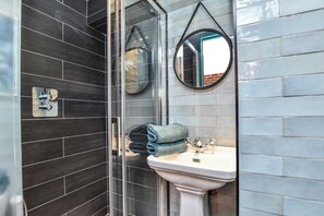 Shower, hair dryer, towels