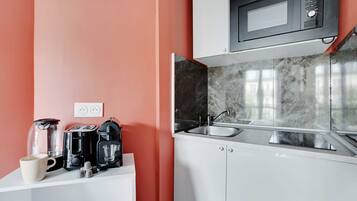 Fridge, microwave, stovetop, coffee/tea maker