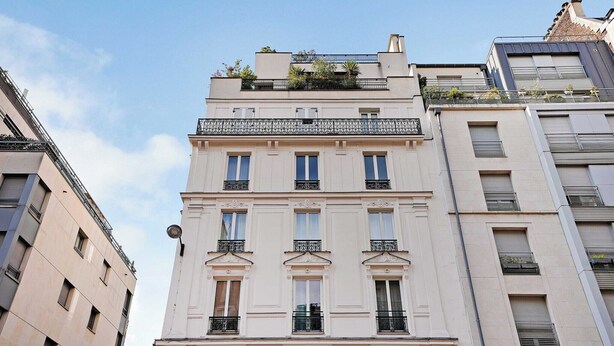 A multi-story building with a classic architectural style, featuring balconies with metal railings and a flat roof. - Comfortable studio - 2P -  Necker (Paris)