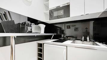 Fridge, microwave, stovetop, coffee/tea maker