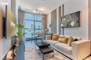 Standard Apartment, Balcony, Canal View | Living room | Flat-screen TV - bnbme | 15 Northside | 1 BDR (Dubai)