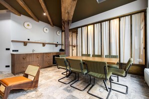 Enjoy meals in this dining area with a long table and six comfortable chairs.