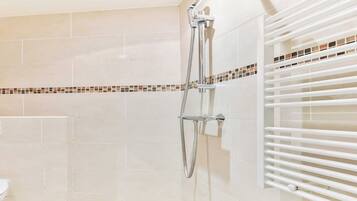 Shower, hair dryer, towels, shampoo