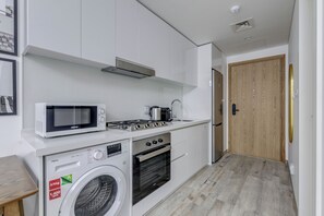 Apartamento luxo, sacada, vista para o canal | Cozinha privada