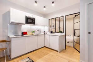 Fridge, microwave, stovetop, coffee/tea maker