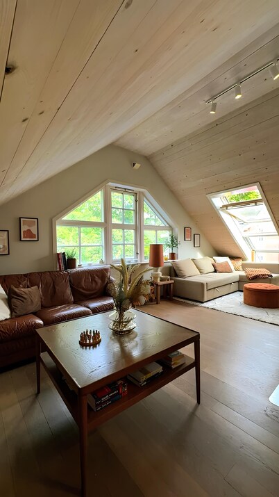 Charming attic apartment by the sea - with fireplace and cozy living room