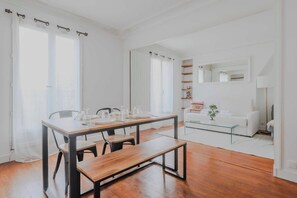 Enjoy a meal in the dining area, complete with a table and chairs, perfect for a quiet evening in.