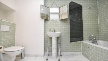 Shower, hair dryer, towels, shampoo