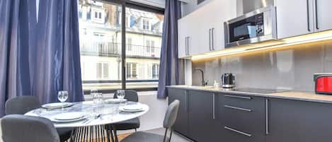 Fridge, microwave, stovetop, coffee/tea maker