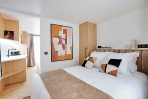 1 غرفة نوم ومكواة/لوح كي وخدمة الإنترنت وملاءات أسرّة