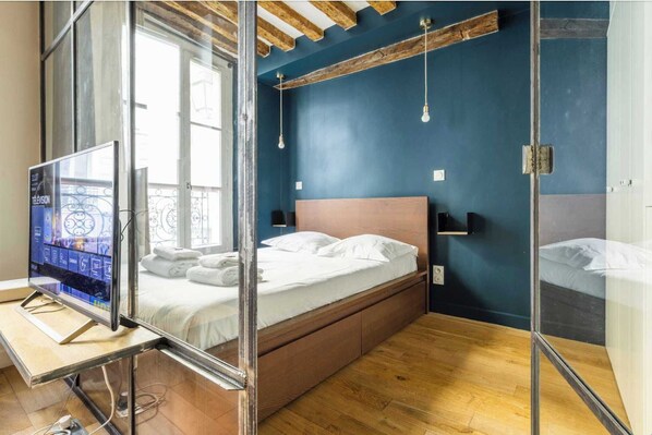 1 bedroom, desk, iron/ironing board, travel crib