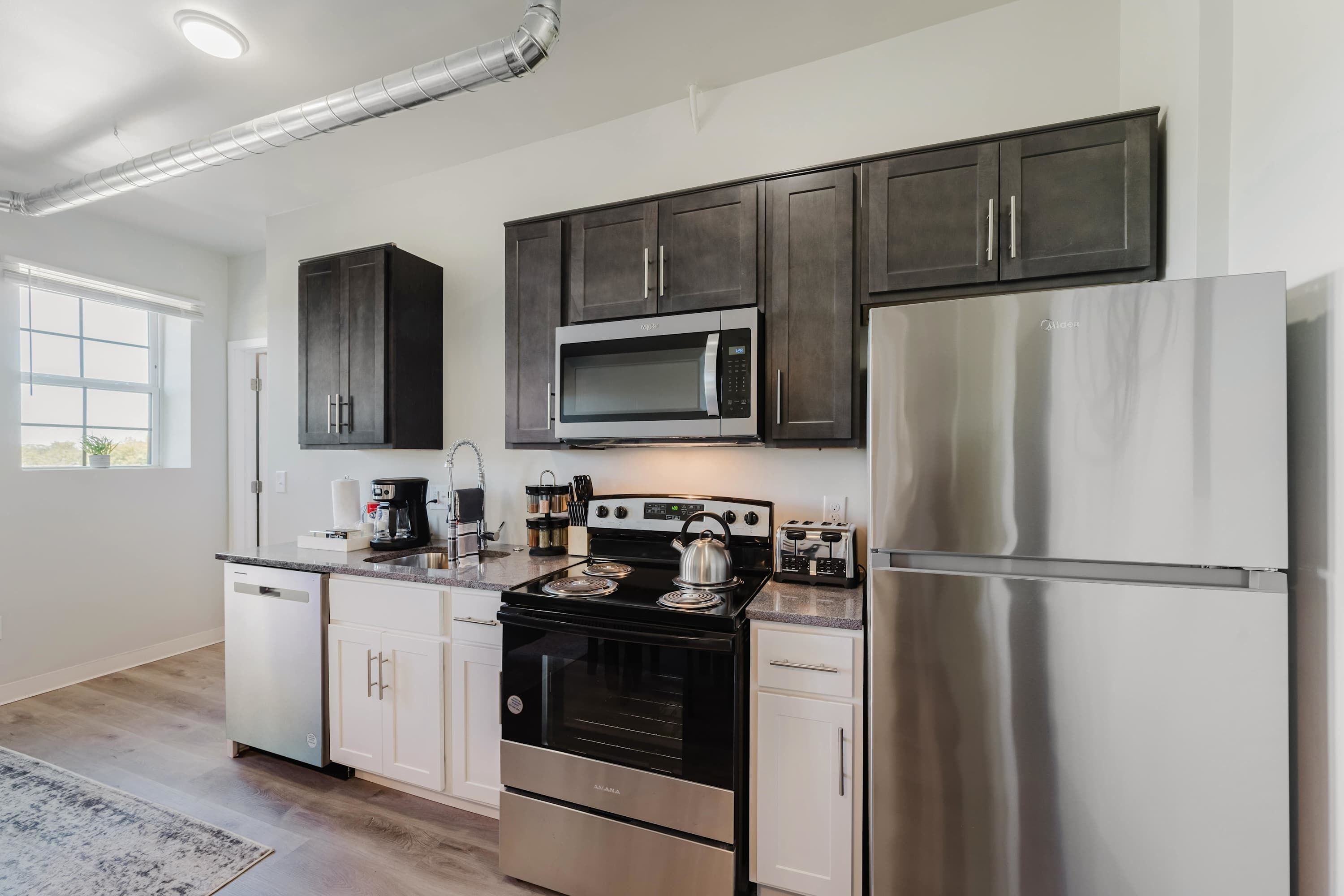 Coffee/tea maker, fridge, microwave, oven