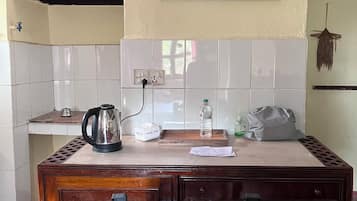 Family Apartment, Garden View | In-room dining