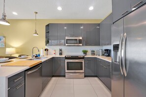 Fridge, microwave, oven, stovetop - Family-Friendly home w/ Pool & Resort Perks Near Disney (Clermont)