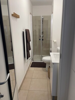 Shower, hair dryer, towels, soap
