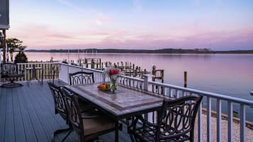 Enjoy al fresco dining with a serene view of the lake from this tranquil outdoor space.