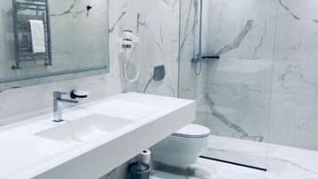 Apartment, 3 Bedrooms, Balcony | Bathroom | Shower, hair dryer, slippers, towels