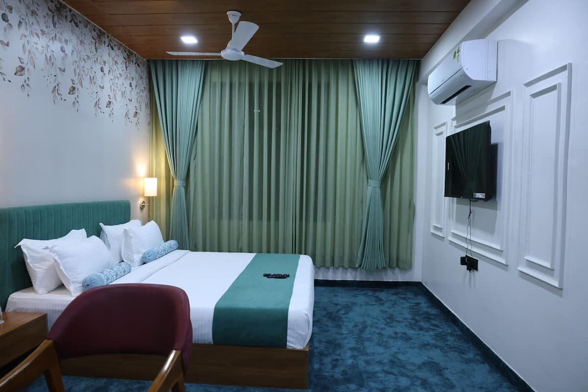 Premium bedding, desk, laptop workspace, iron/ironing board